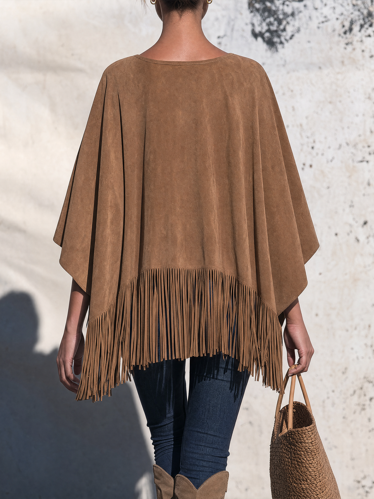 Bartolomea | Poncho in leerkleur met franjes
